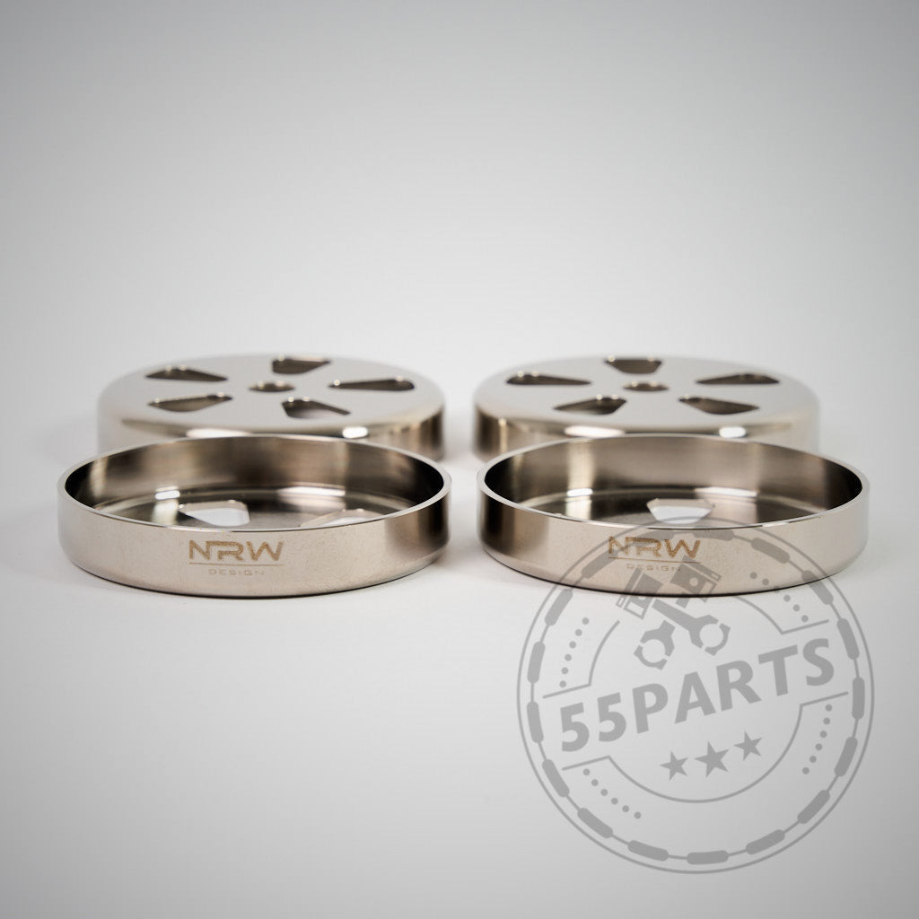 Vier runde, metallische NRW Design Billet 4130 Stahl VANOS Kappen sind auf einer weißen Oberfläche abgebildet - perfekte VANOS Abdeckungen für BMW E9X M3 S65 Motor Fans.