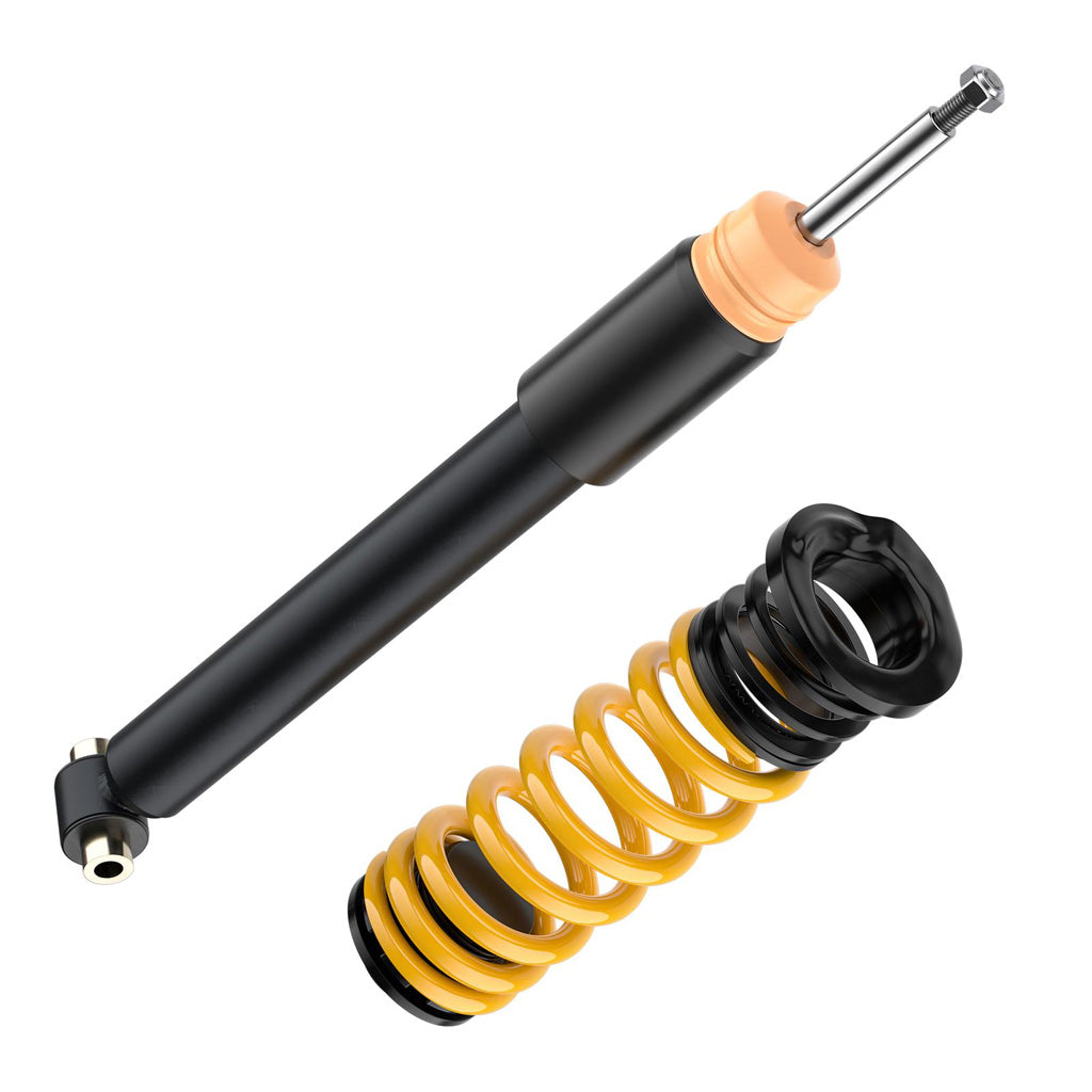 Ein schwarz-gelbes ST X Gewindefahrwerk-Kit für BMW 1er F20/21, 2er F22/23, 3er F30/31 und 4er F32 steht isoliert auf einem weißen Hintergrund.