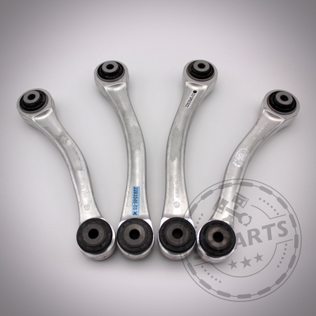 Vier M3 Fahrwerkskomponenten (mit NoFlex-Lagern) Komplettset – Uniball Zugstrebenlager passend für BMW 1er E8x & 3er E9x, nebeneinander auf einer hellen Oberfläche mit dem Fahrwerk-Parts-Logo dargestellt – perfekt für Upgrades und Modifikationen.